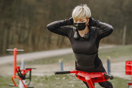Photo by Gustavo Fring: https://www.pexels.com/photo/young-woman-in-protective-mask-doing-hyperextension-exercise-outdoors-4127505/