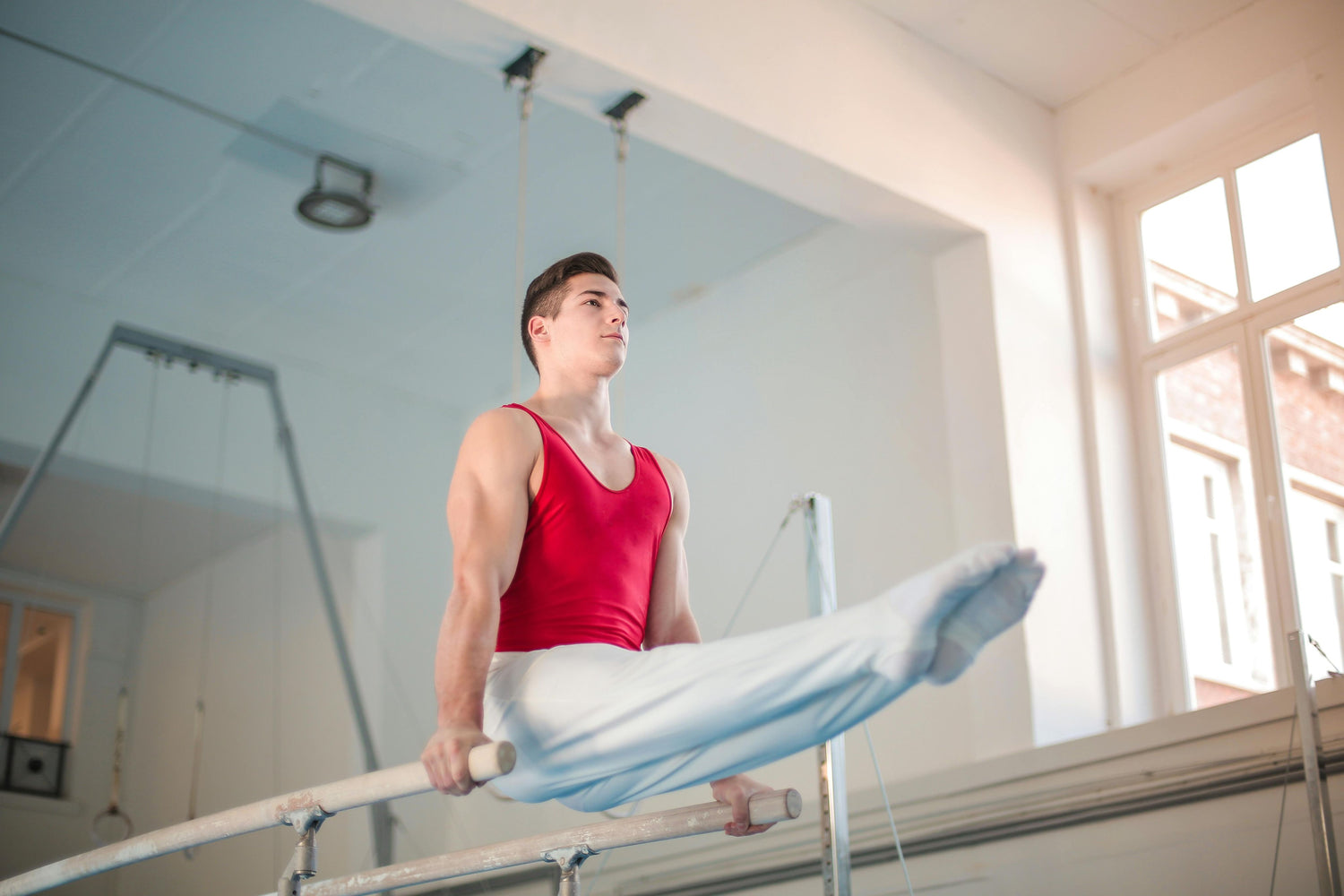 Photo by Andrea Piacquadio: https://www.pexels.com/photo/photo-of-male-gymnast-practicing-in-gym-3763700/