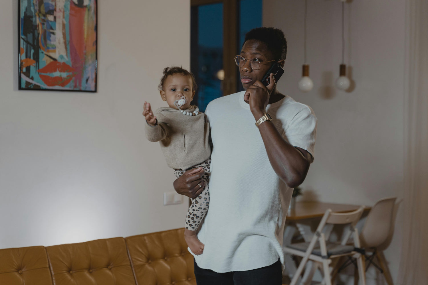 Photo by Tima Miroshnichenko: https://www.pexels.com/photo/a-father-carrying-his-daughter-while-on-a-phone-call-6321633/