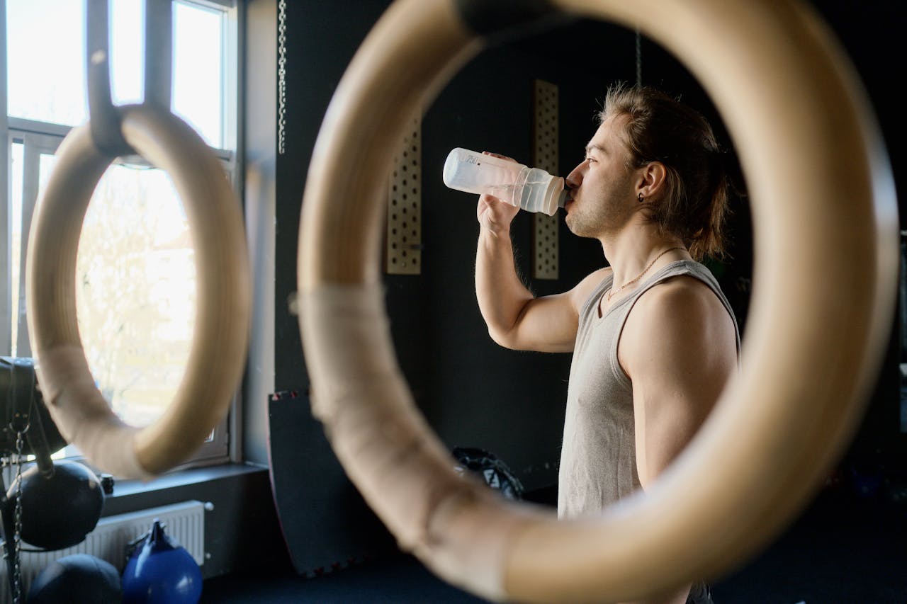 Photo by Ivan Samkov: https://www.pexels.com/photo/man-sitting-on-the-floor-and-drinking-water-4164764/