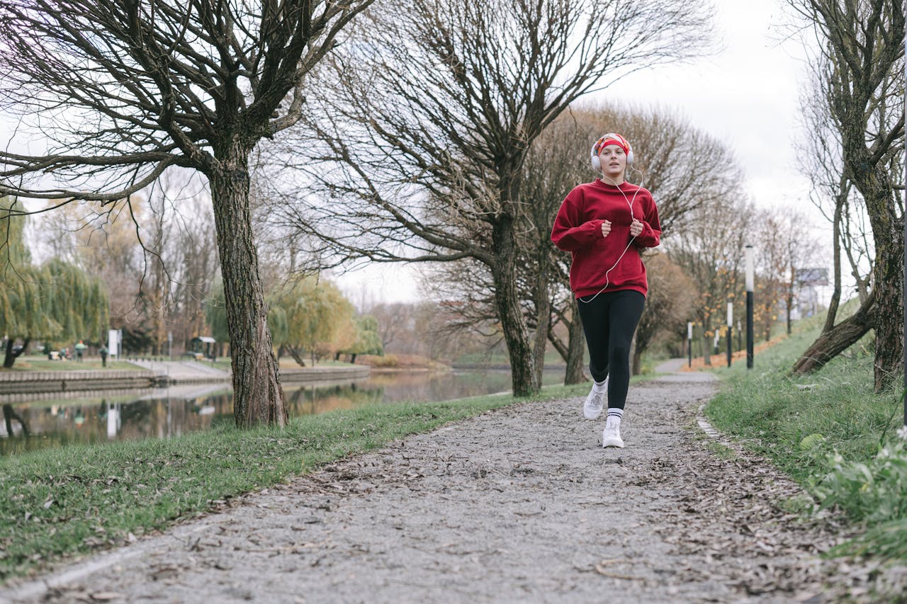 Photo by Ivan Samkov: https://www.pexels.com/photo/woman-in-red-sweater-running-on-pathway-6436063/