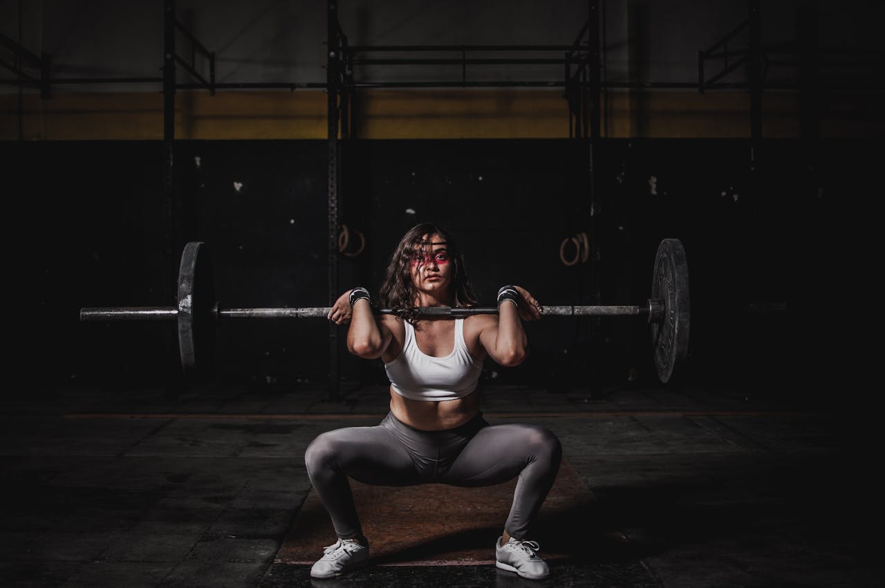 Photo by Leon Ardho: https://www.pexels.com/photo/woman-lifting-barbell-1552249/