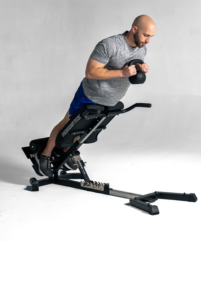 Back extension with a kettlebell on the NordBench Pro