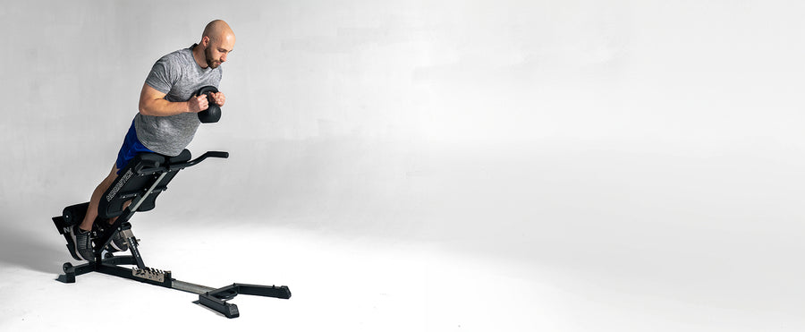 Back extension with a kettlebell on the NordBench Pro