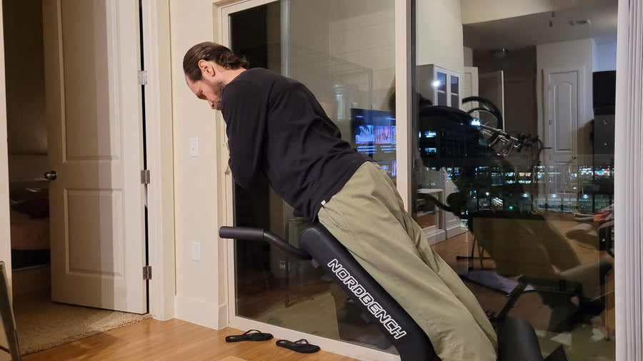 Daniel Allen performing a back extension on the NordBench Pro